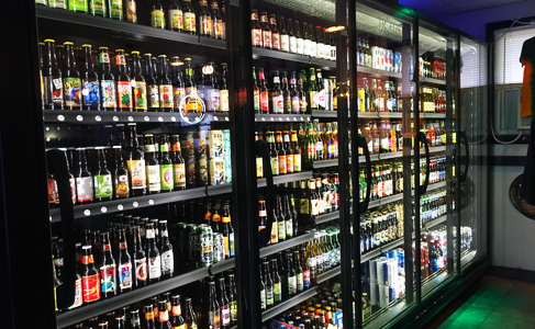 Buy and try a single beer from the huge, fully stocked cooler at Lucky Louie’s Beer and Wieners next door (shown.)